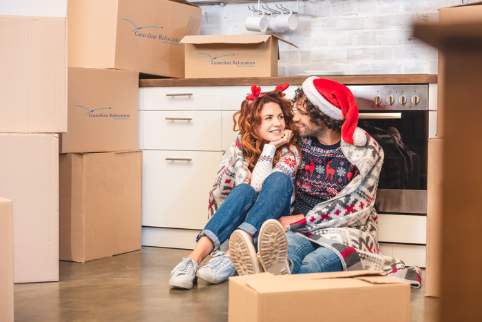young couple preparing to move during the holidays