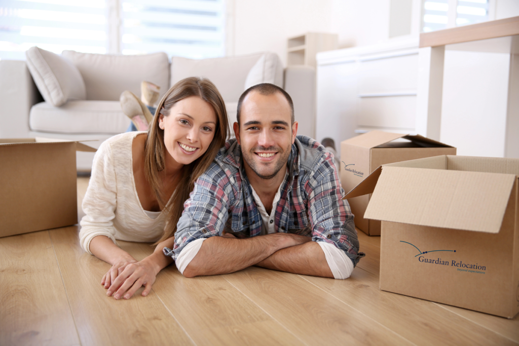Young couple preparing for a move. Guardian Relocation Moving Company